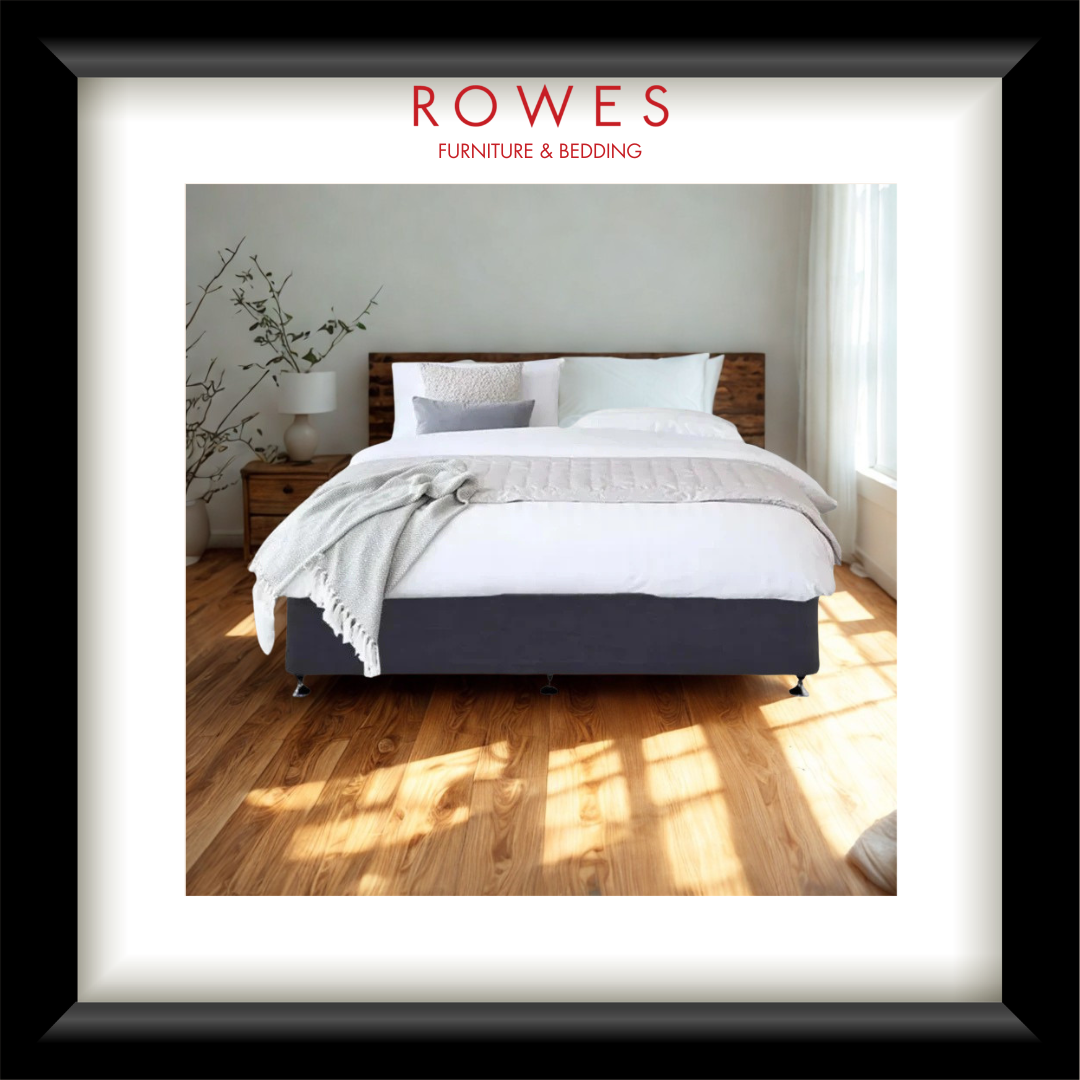 Bedroom with a bed and nightstands, featuring Rowes Furniture & Bedding logo.