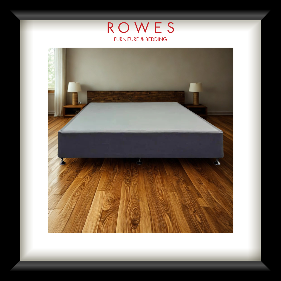 Bed with wooden headboard on a wooden floor, featuring Rowes Furniture & Bedding logo.