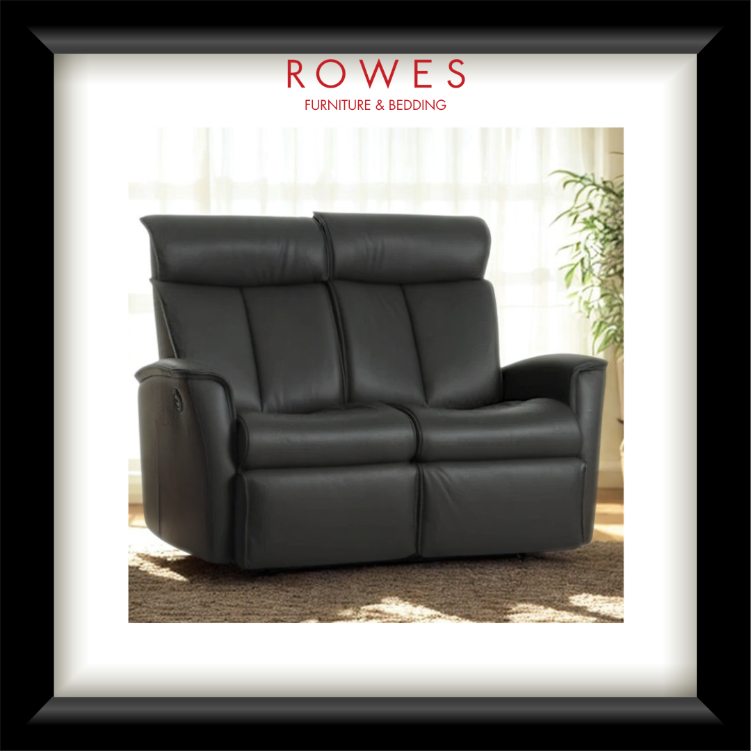 Black leather sofa in a room with curtains and a plant, branded as Rowes Furniture & Bedding.