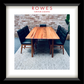 A framed art print featuring a dining room scene with a wooden table and black chairs, matted with a white border and enclosed in a black frame. The top of the print has the text 'ROWES FURNITURE & BEDDING' in red.