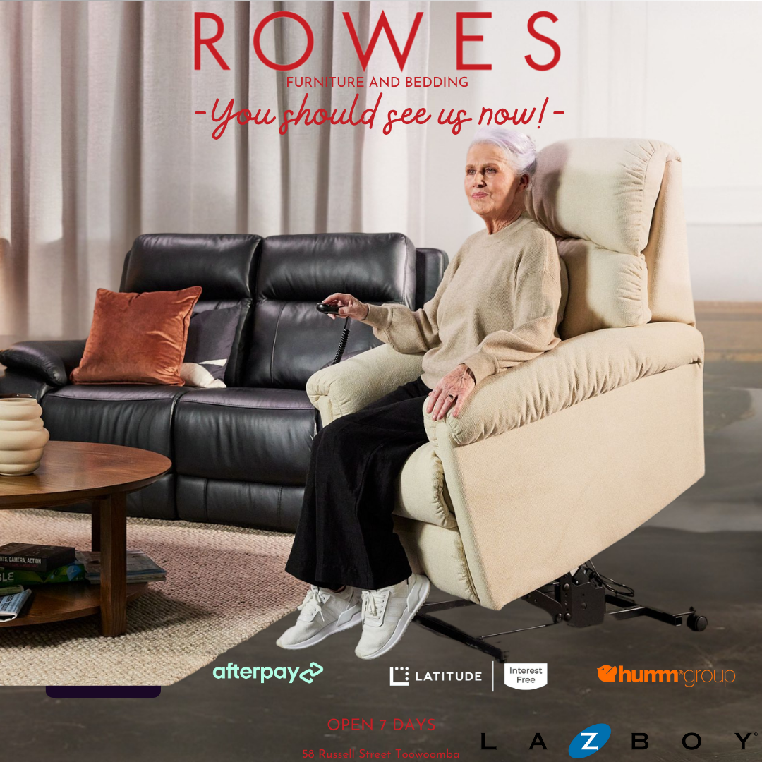 Woman sitting on a recliner chair in a living room with 'Rowes Furniture and Bedding' advertisement.