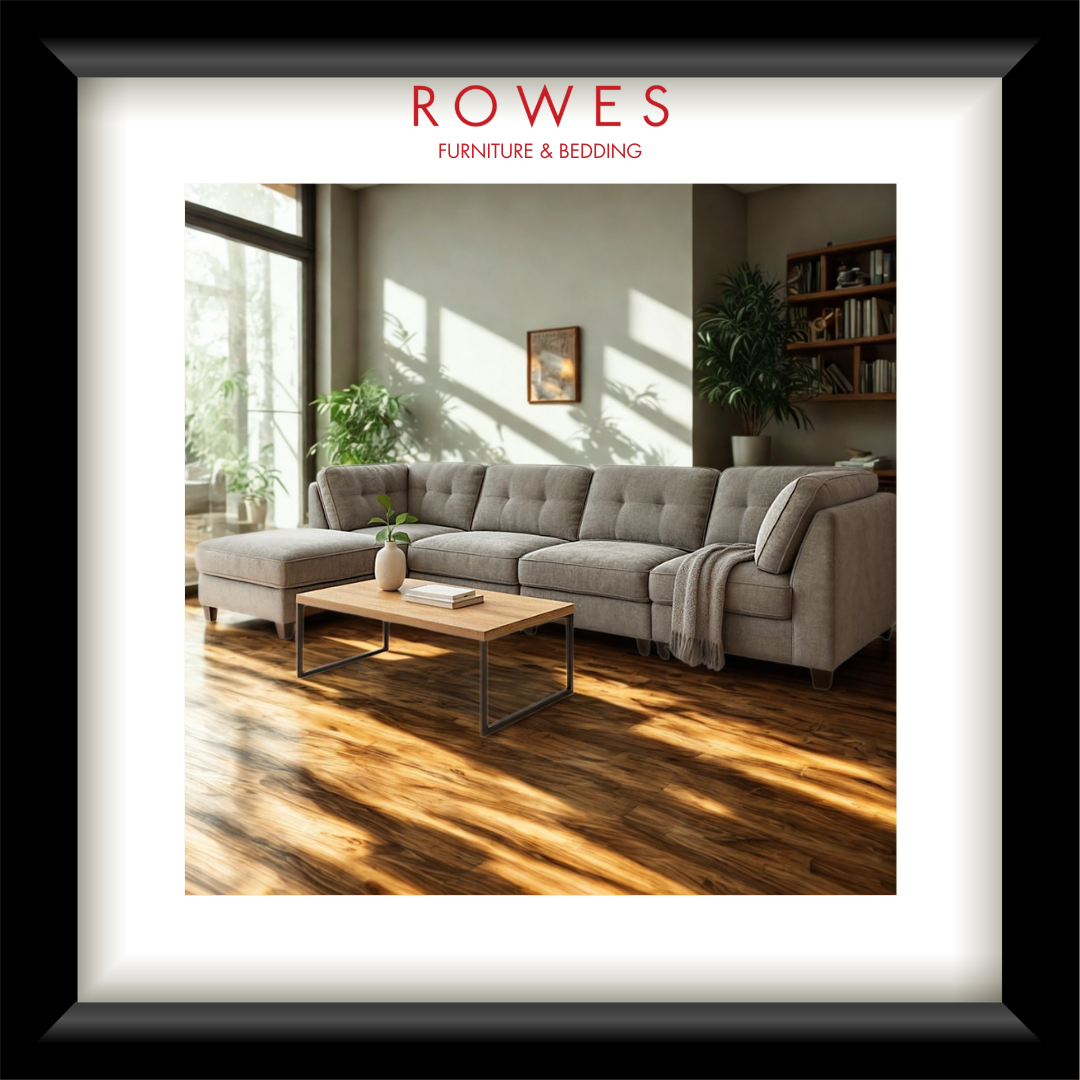 Beige Sofa in a well lit room with plants and a coffee table