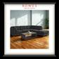 A Dark sofa and ottoman in a well lit room with a single plant in the corner. 