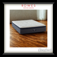 Mattress on a wooden floor with 'Rowes Furniture & Bedding' and 'Sleepyhead' branding.