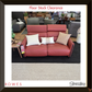Red sofa with cushions in a showroom setting, featuring 'Rowes' and 'Stressless' brands.