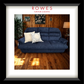 Blue sofa with decorative pillows in a room setting, featuring 'Rowes Furniture & Bedding' branding.