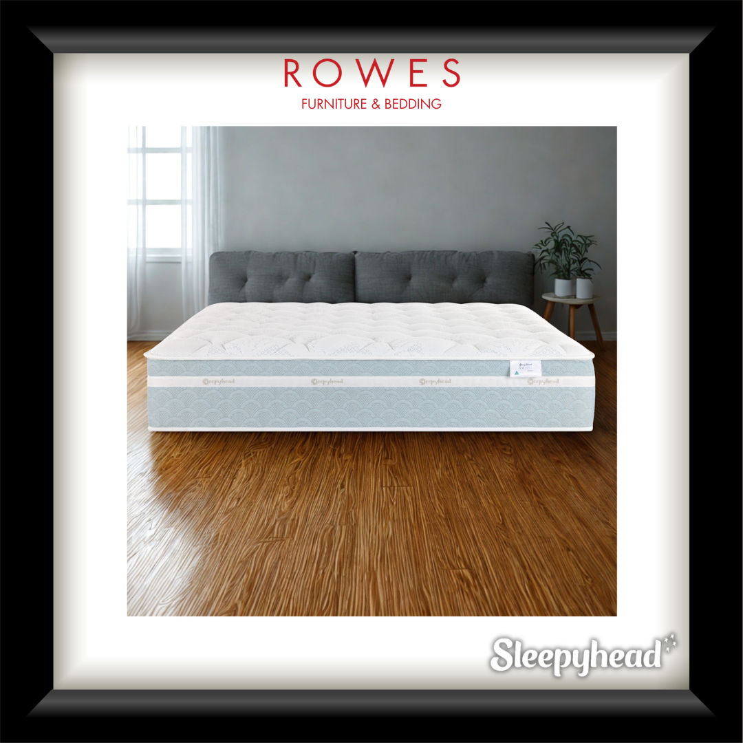 Mattress on a wooden floor with 'Rowes Furniture & Bedding' and 'Sleepyhead' branding.