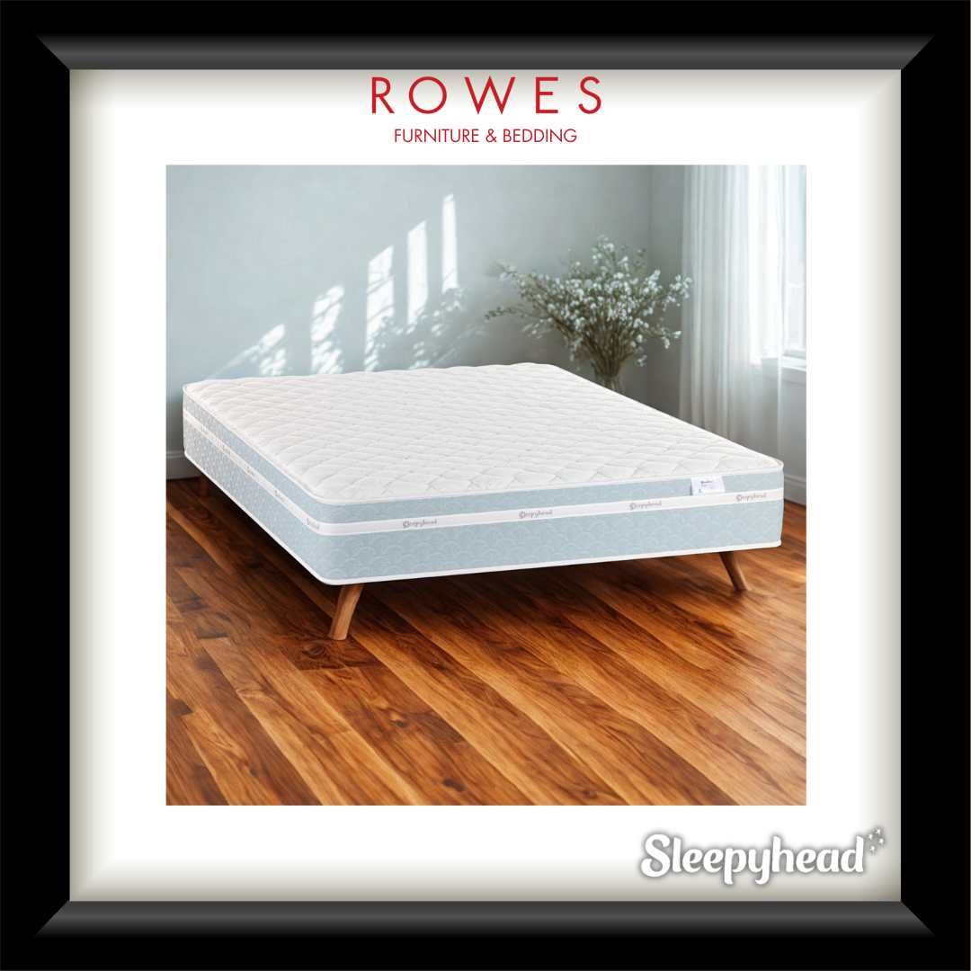 Mattress on a wooden floor with 'Rowes Furniture & Bedding' and 'Sleepyhead' branding.