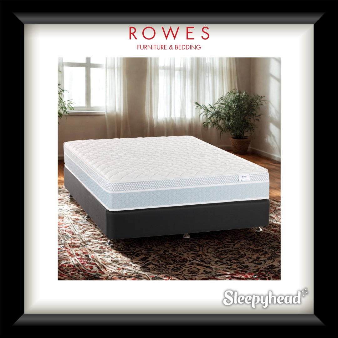 Sleepyhead mattress in a room setting with curtains and plants, featuring Rowes Furniture & Bedding branding.