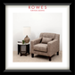 Gray armchair in a room with a lamp and side table, featuring Rowes Furniture & Bedding logo.