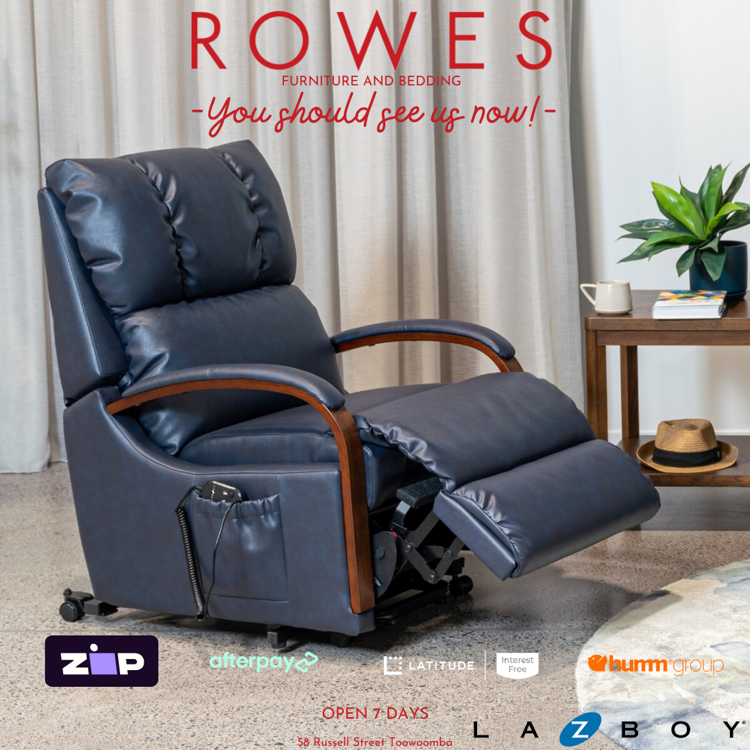 Blue recliner chair in a living room setting with 'Rowes Furniture and Bedding' advertisement.