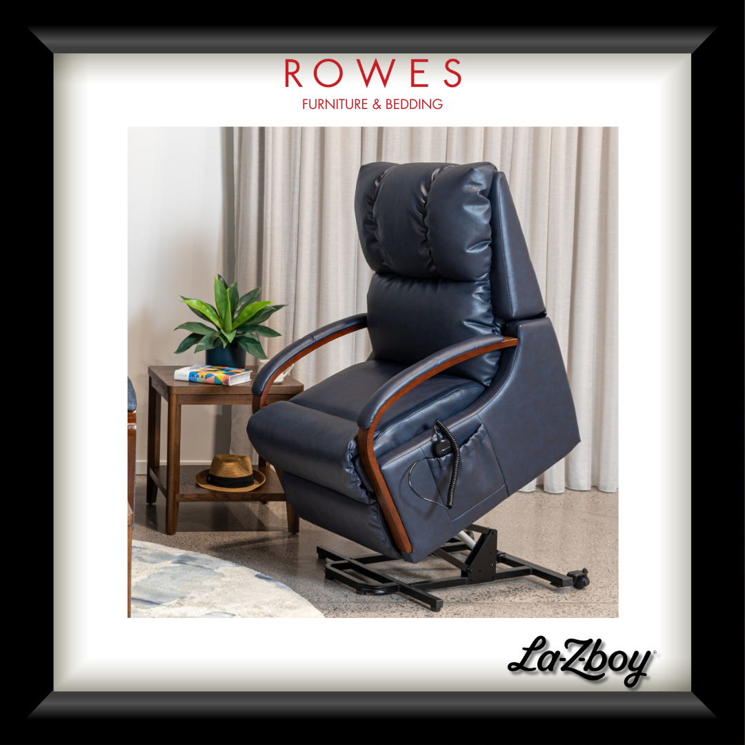 Blue recliner chair with wooden armrests in a room setting, featuring Rowes Furniture & Bedding logo.