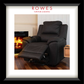 A framed product photograph of a black leather recliner chair in a living room setting with a fireplace, presented in a black frame with a white mat. The brand name 'ROWES FURNITURE & BEDDING' is printed at the top of the photo.