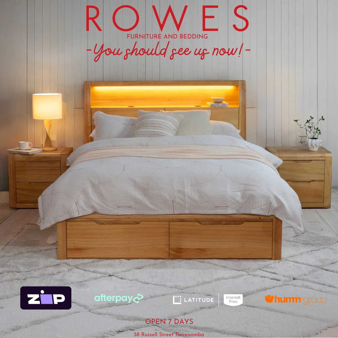 Wooden bed with bedding in a bedroom setting, featuring 'Rowes Furniture and Bedding' advertisement.