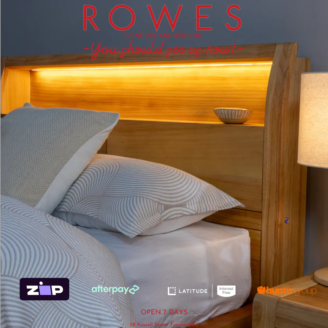 Bed with wooden headboard and pillows, featuring Rowes branding and payment options.