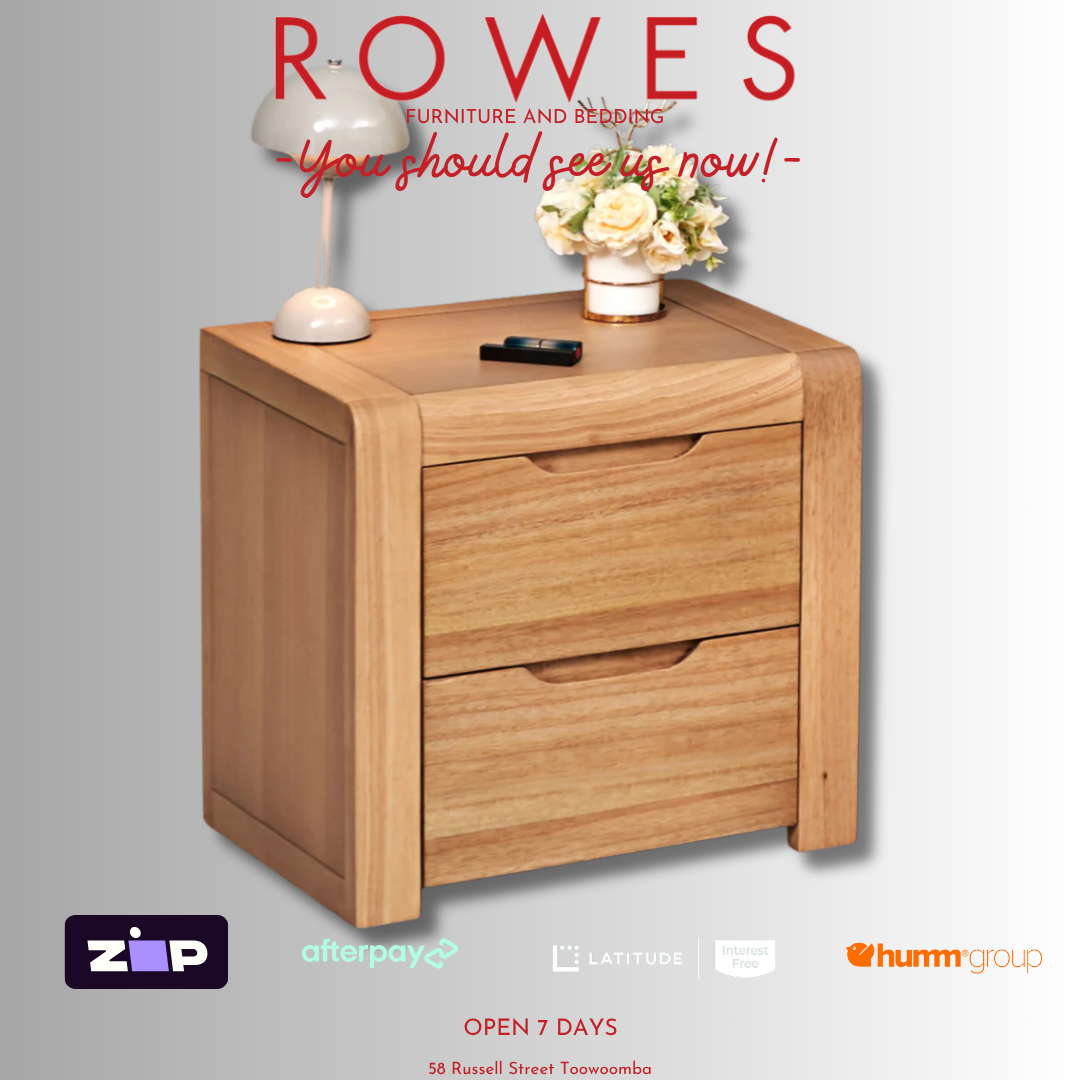 Wooden nightstand with lamp and flowers on a gray background, featuring 'Rowes' furniture brand.