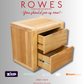 Wooden nightstand with open drawers on a gray background, featuring 'Rowes' furniture brand.