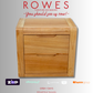 Wooden nightstand with 'Rowes Furniture and Bedding' text and payment logos on a gray background