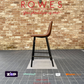 Brown bar stool against a brick wall with promotional text for ROWES.