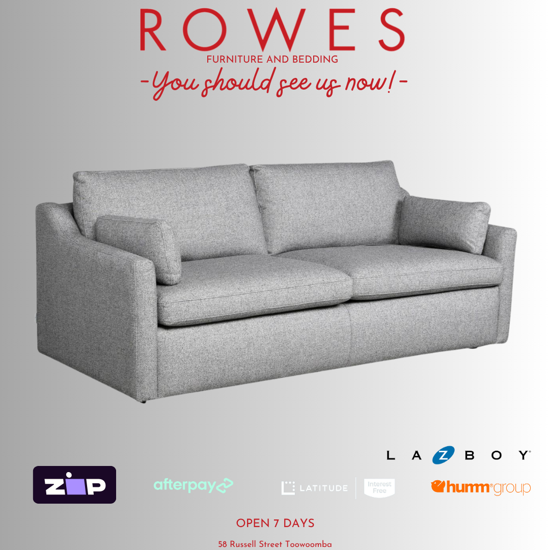 A LaZboy Huntington sofa set, featuring a grey color scheme, a streamlined silhouette, and sloped arm detailing. 