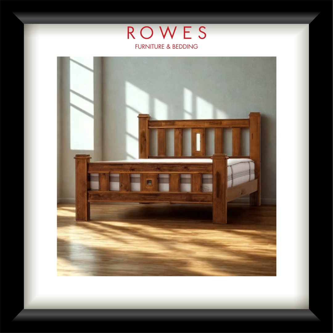 Wooden bed with white bedding in a room with sunlight filtering through windows, branded 'Rowes Furniture & Bedding'.