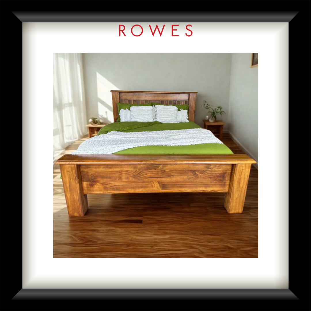 A large bed with green and white linens in a large bedroom. The image features the Rowes branding