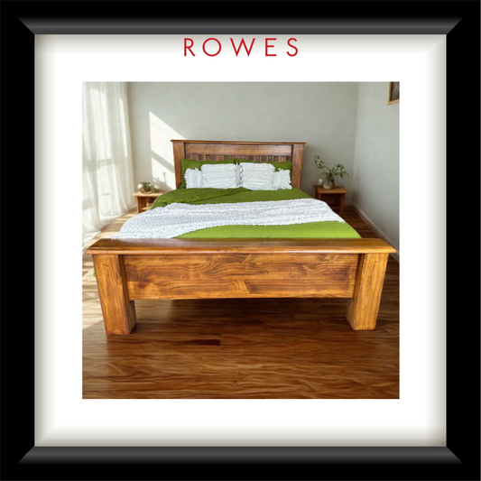 A large bed with green and white linens in a large bedroom. The image features the Rowes branding