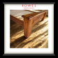 A large timber bed in a well lit room with the Rowes branding