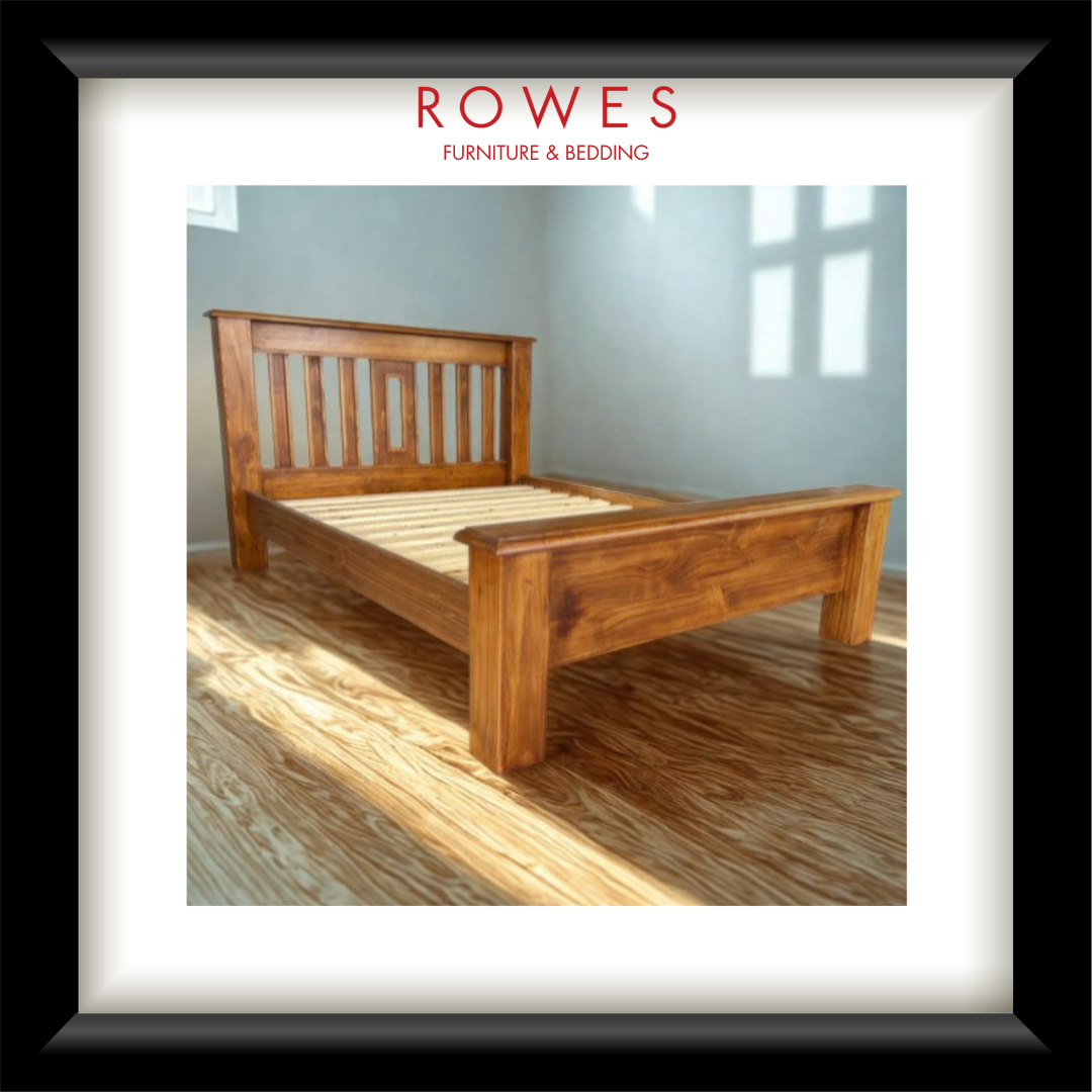A large timber bed in a well lit room with the Rowes branding
