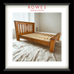 A large timber bed in a well lit room with the Rowes branding