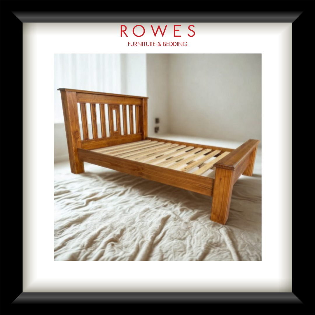 A large timber bed in a well lit room with the Rowes branding