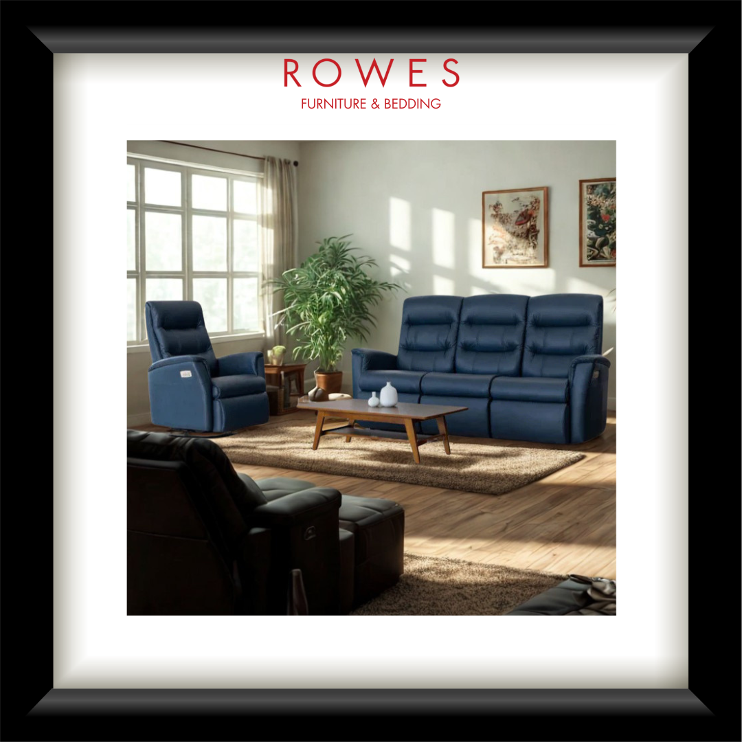 Living room with blue recliner sofas and a coffee table, featuring ROWES Furniture & Bedding logo.