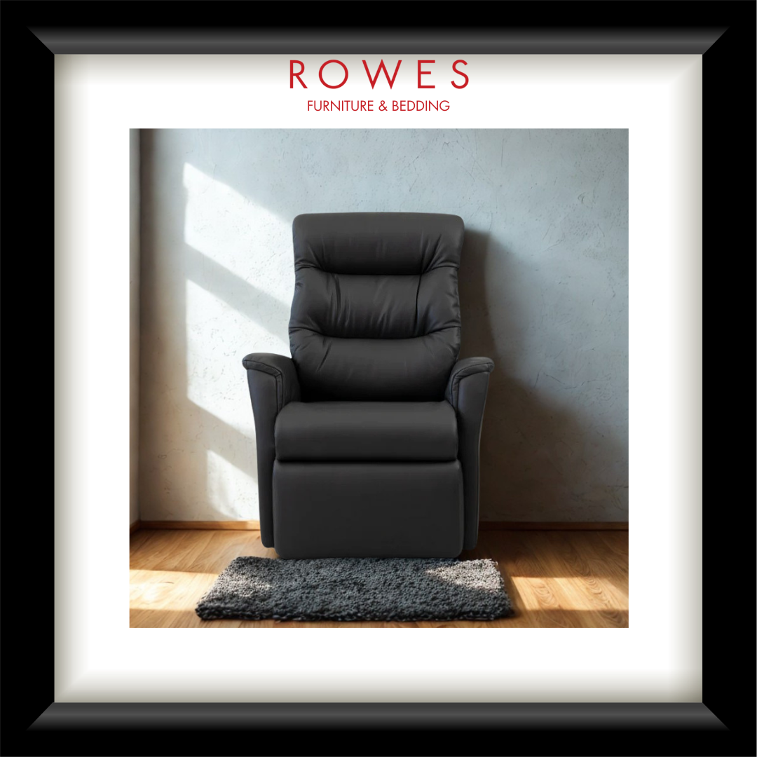 Gray recliner chair in a room with sunlight streaming through a window, branded 'Rowes Furniture & Bedding'.