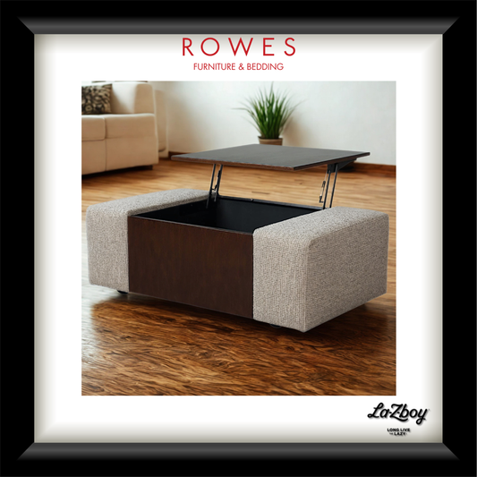A framed furniture catalog-style photo showing a square ottoman/coffee table with upholstered light beige side panels, a dark wood center panel, and a dark lift-top table. The frame contains the text 'ROWES FURNITURE & BEDDING' at the top and 'LaZboy' at the bottom right.