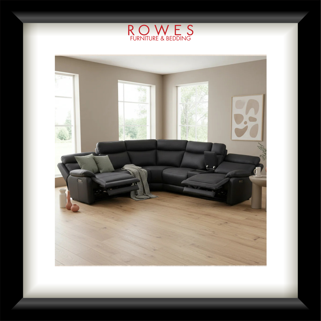 Black sectional sofa in a living room with 'Rowes Furniture & Bedding' branding.