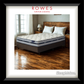 Mattress on a bed in a bedroom with 'Rowes Furniture & Bedding' branding.