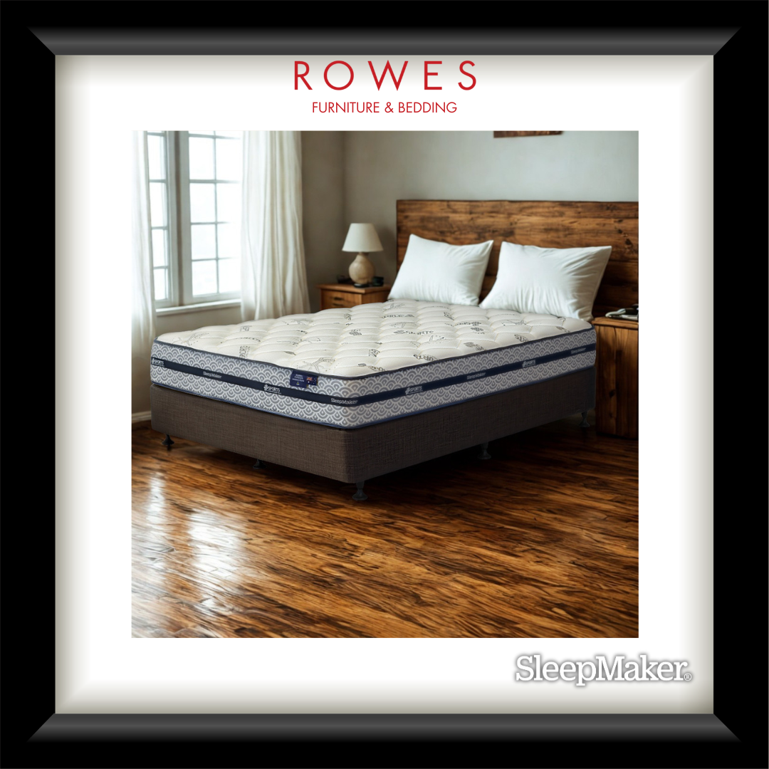 Mattress on a bed in a bedroom with 'Rowes Furniture & Bedding' branding.