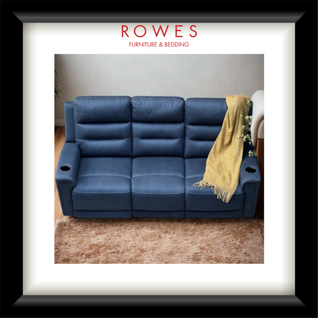 Blue sofa with a yellow blanket on a brown carpet, branded as Rowes Furniture & Bedding.
