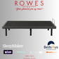 Black bed frame with promotional text and logos on a gray background