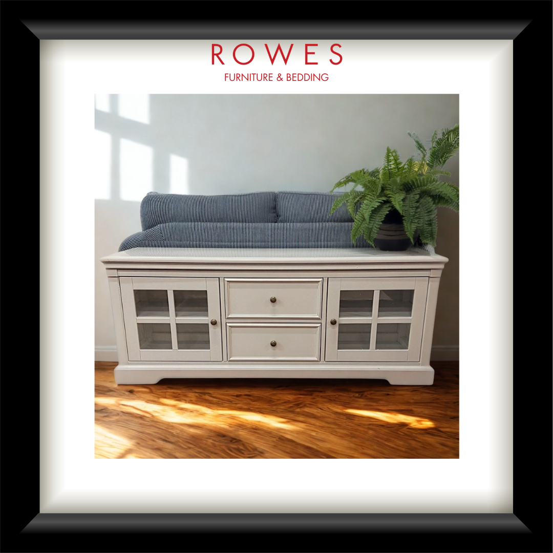 A white cabinet in a well lit room on a timber floor with Rowes branding