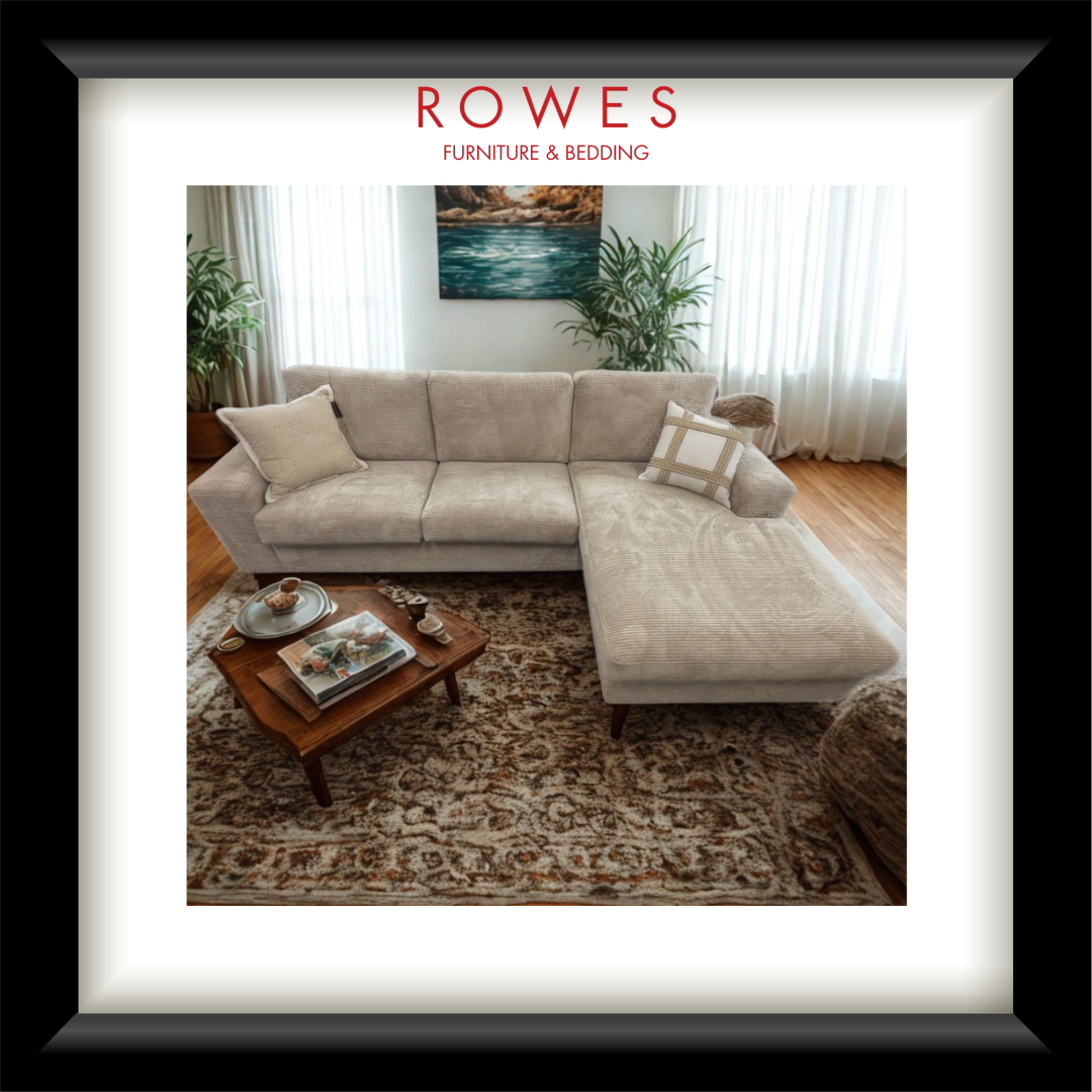 Beige sectional sofa in a living room with 'Rowes Furniture & Bedding' branding.