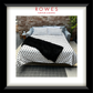 Furniture and bedding set with polka dot pattern on a bed, branded as Rowes Furniture & Bedding.