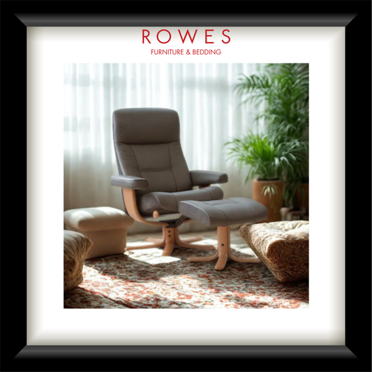 Gray armchair with ottoman in a room with plants and sunlight, featuring 'Rowes Furniture & Bedding' logo.