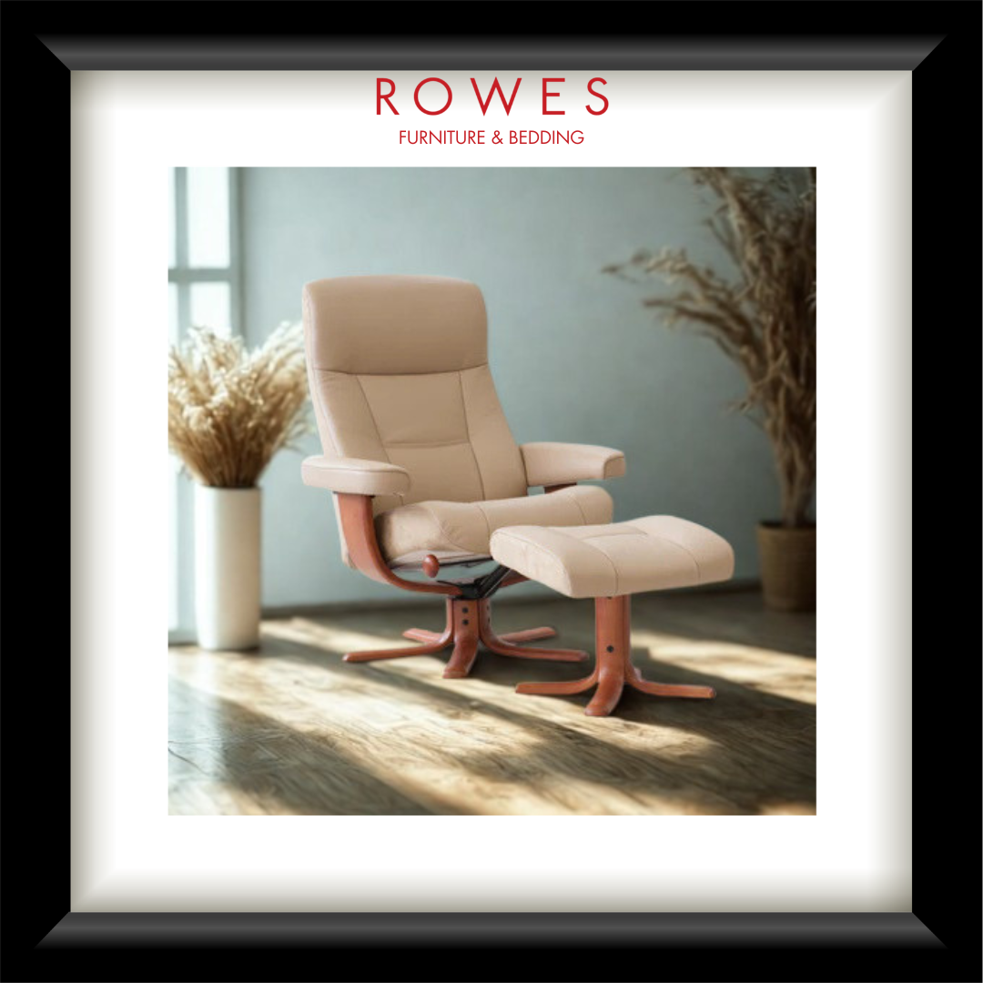 Beige recliner chair with ottoman in a room with plants and sunlight.