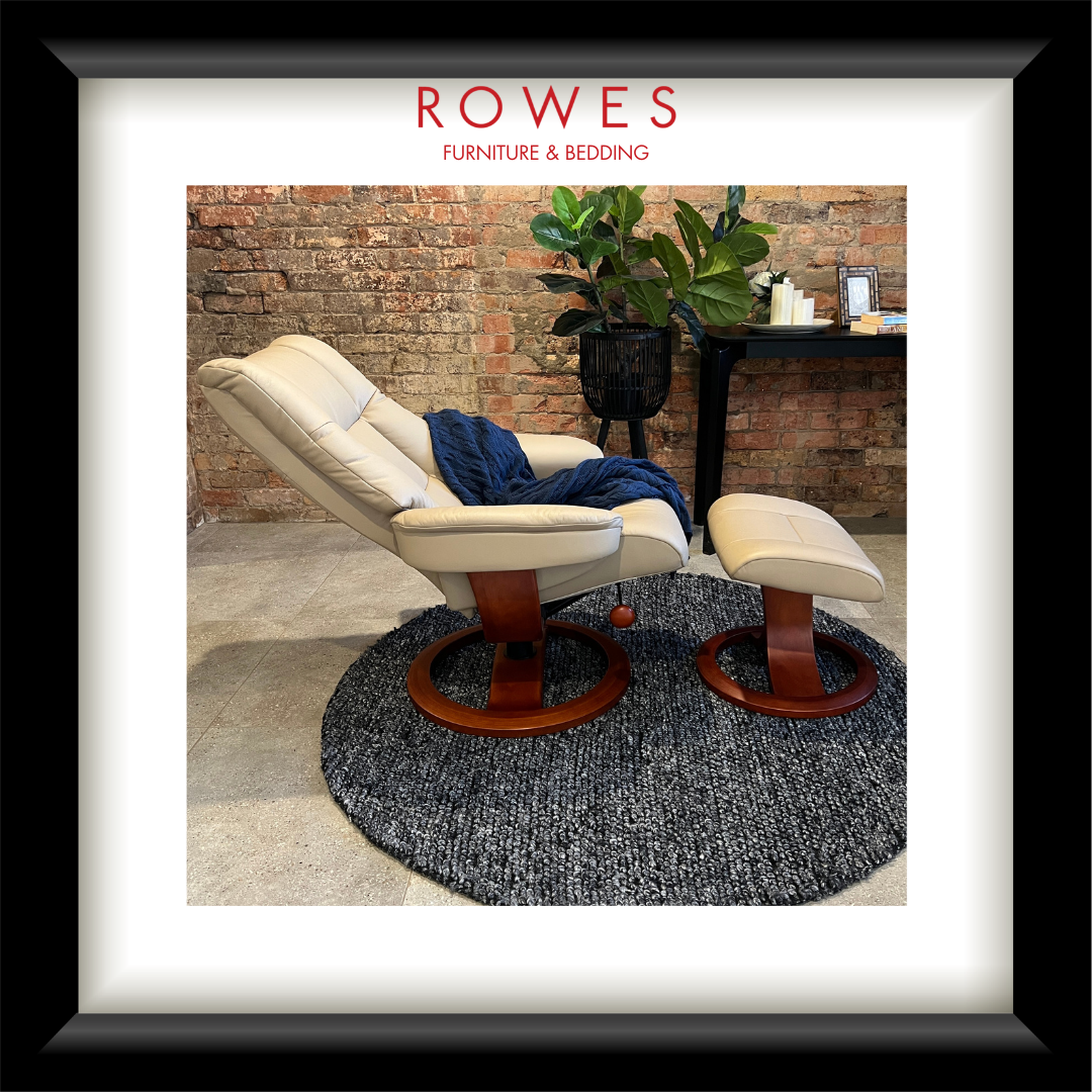 White recliner chair with wooden base on a gray rug, with 'Rowes Furniture & Bedding' logo above.