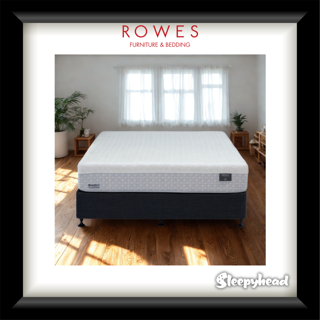 White mattress on a wooden floor with 'Rowes Furniture & Bedding' and 'Sleepyhead' branding.