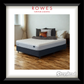 Bed with pillows and blankets in a room, featuring 'Rowes Furniture & Bedding' and 'Sleepyhead' logos.