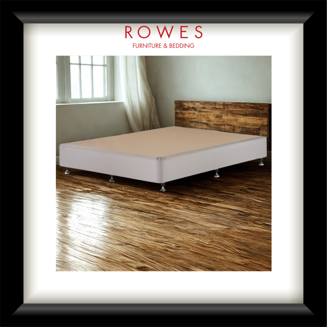 Bed with wooden headboard on a wooden floor, featuring ROWES Furniture & Bedding logo.
