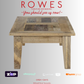 Wooden table with 'Rowes Furniture and Bedding' advertisement on a gray background