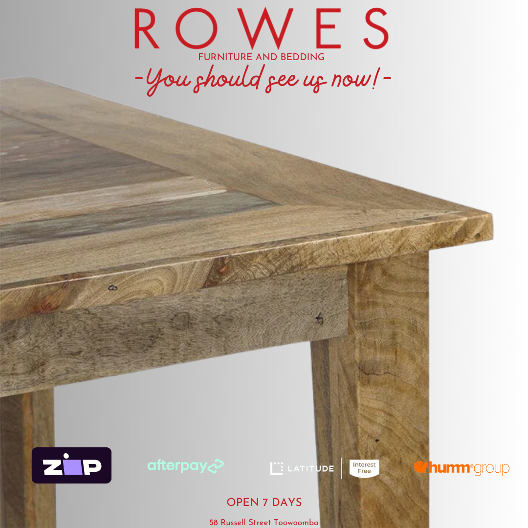 Wooden table with 'Rowes Furniture and Bedding' advertisement on a white background